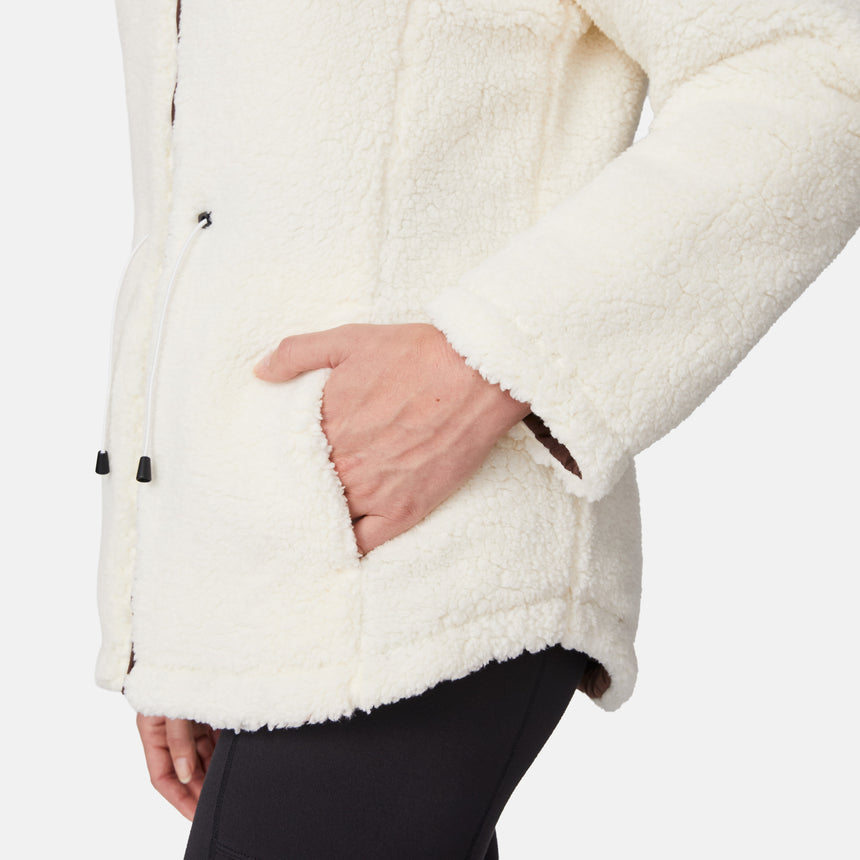 [Emily is 5'9" wearing size S.] Model wearing brown quilted jacket with hood and black pants — reversible design with cream pile interior for cozy, cold-weather layering