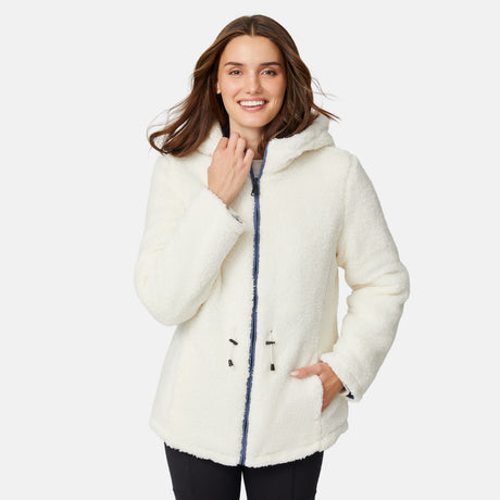 [Jessica is 5'9.5" wearing size S.] Model wearing blue quilted jacket with hood and black pants — reversible design with cream pile interior for cozy, cold-weather layering