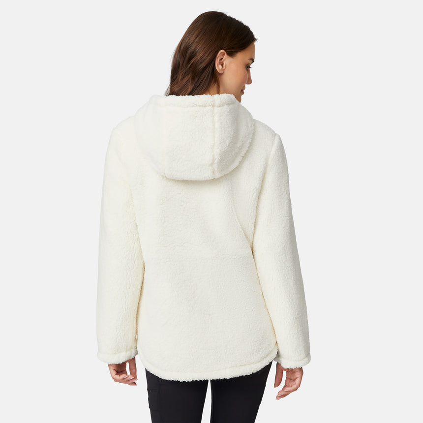 [Jessica is 5'9.5" wearing size S.] Model wearing blue quilted jacket with hood and black pants — reversible design with cream pile interior for cozy, cold-weather layering