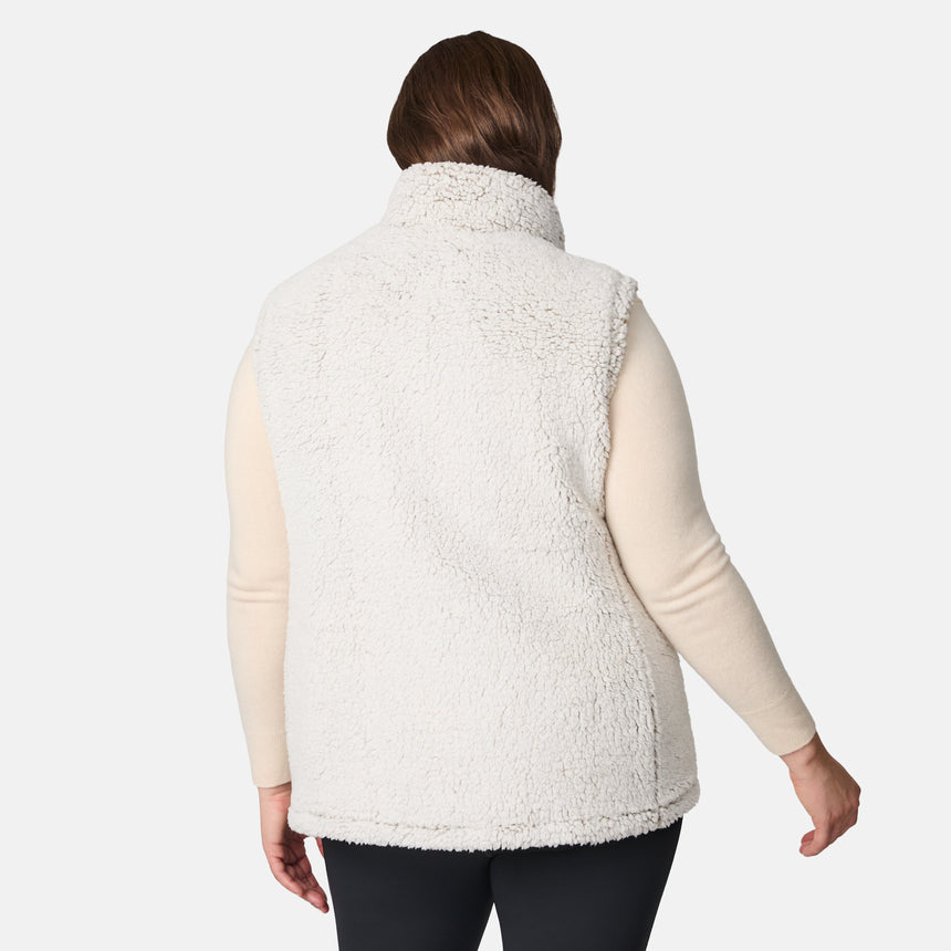 [Karissa is 5'9.5" wearing size 1X.]  Women’s Free Country light green diamond-quilted vest with zip-front closure and zippered pockets—reverses to cozy sherpa for added warmth and texture. Styled over a light long-sleeve shirt and dark pants for a versatile, cold-weather look.