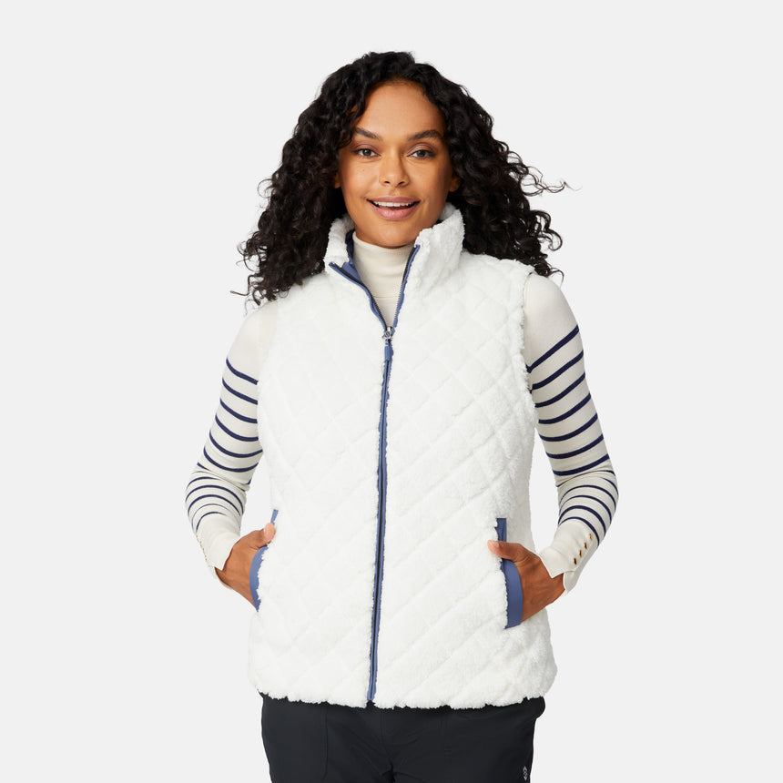 [Angelique is 5'10" wearing size S.] Woman wearing a white quilted vest with blue accents on a white background