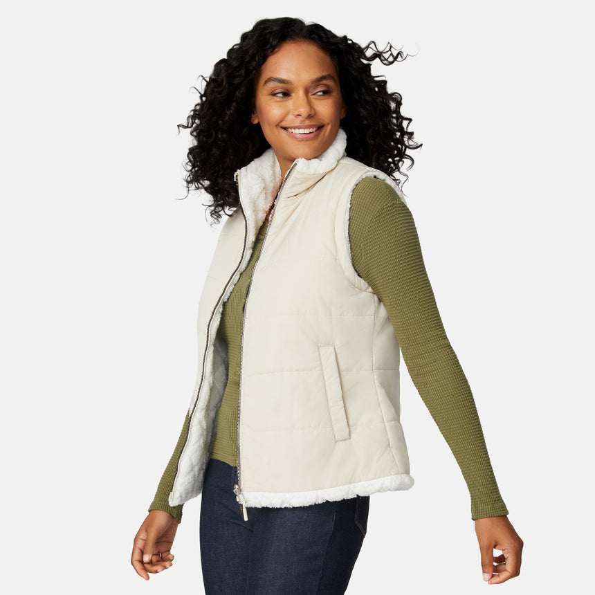 [Angelique is 5'10" wearing size S.] Woman wearing a cream vest over a green long-sleeve shirt on a white background