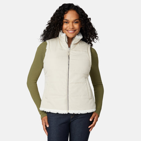 [Angelique is 5'10" wearing size S.] Woman wearing a cream vest over a green long-sleeve shirt on a white background
