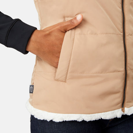 [Angelique is 5'10" wearing size S.] Close-up of a person wearing a beige quilted jacket with a brand logo on a white background