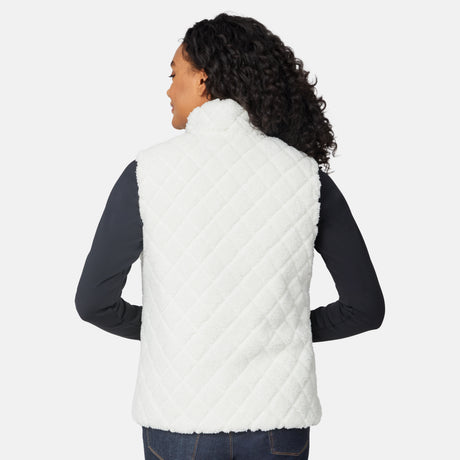 [Angelique is 5'10" wearing size S.] Person wearing a white quilted vest on a white background