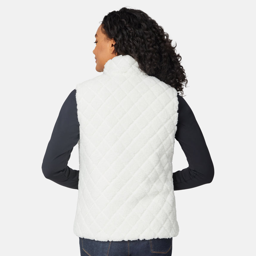 [Angelique is 5'10" wearing size S.] Person wearing a white quilted vest on a white background