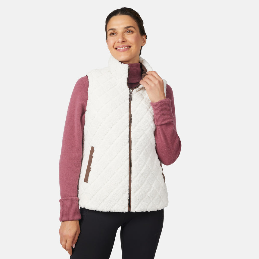 [Olga is 5'9" wearing size S.] Woman wearing a white quilted vest over a pink long-sleeve shirt on a light gray background