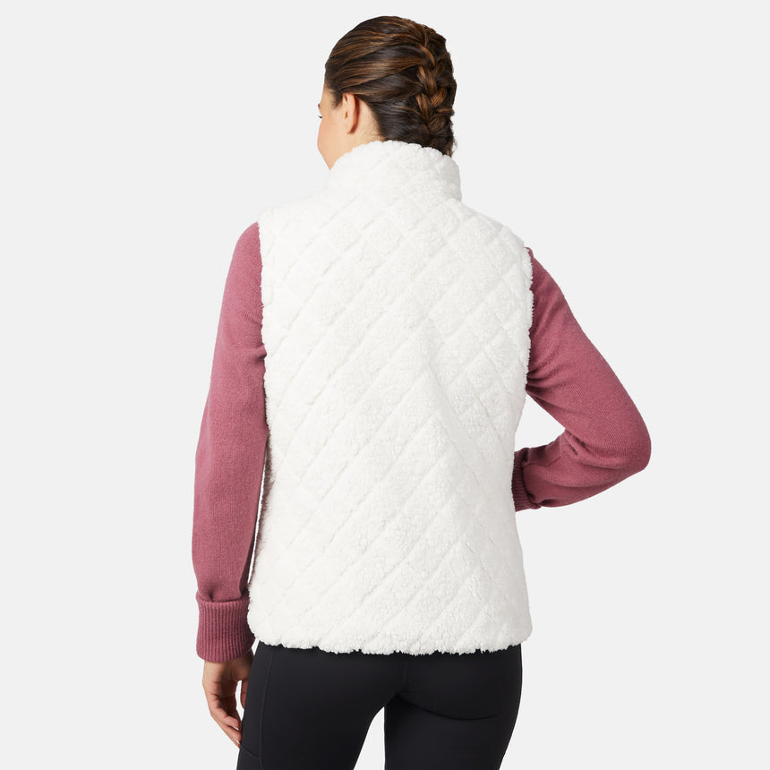 [Olga is 5'9" wearing size S.] Person wearing a white quilted vest over a pink long-sleeve shirt on a white background