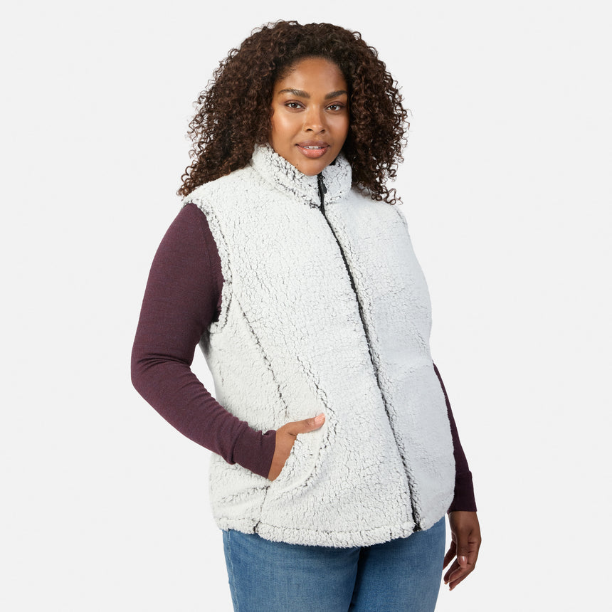 Plus size woman wearing the light gray sherpa reverse of the Stratus Lite II vest with burgundy sleeves visible