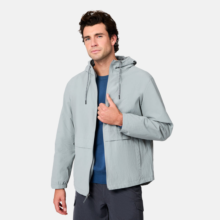 [Jacob is 6’1.5" wearing size M] Man wearing a light gray jacket on a white background