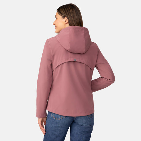 [Olga is 5’9” wearing a size Small.] Woman wearing Free Country Women's Alps Super Softshell® Jacket in pink with a full front zipper opening, soft lining, attached hood with adjustable drawcords, and water resistant and wind resistant stretch performance fabric, light grey background. Perfect women’s  jacket for fall weather.