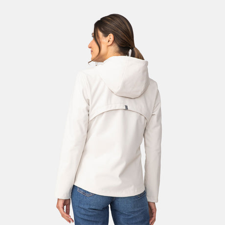 [Olga is 5’9” wearing a size Small.] Woman wearing Free Country Women's Alps Super Softshell® Jacket in white with a full front zipper opening, soft lining, attached hood with adjustable drawcords, and water resistant and wind resistant stretch performance fabric, light grey background. Perfect women’s  jacket for fall weather.
