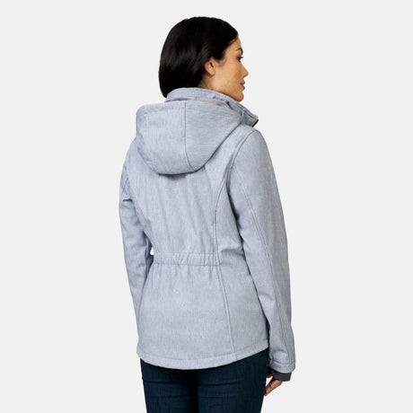 [Megan is 5’6” wearing a size Small.] Woman wearing Free Country Women's Aeris II Super Softshell® Jacket in textured grey with a full front zipper opening, soft lining, detachable hood, and water resistant and wind resistant stretch performance fabric, light grey background. Perfect women’s  jacket for fall weather.