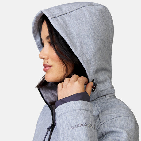 [Megan is 5’6” wearing a size Small.] Woman wearing Free Country Women's Aeris II Super Softshell® Jacket in textured grey with a full front zipper opening, soft lining, detachable hood, and water resistant and wind resistant stretch performance fabric, light grey background. Perfect women’s  jacket for fall weather.