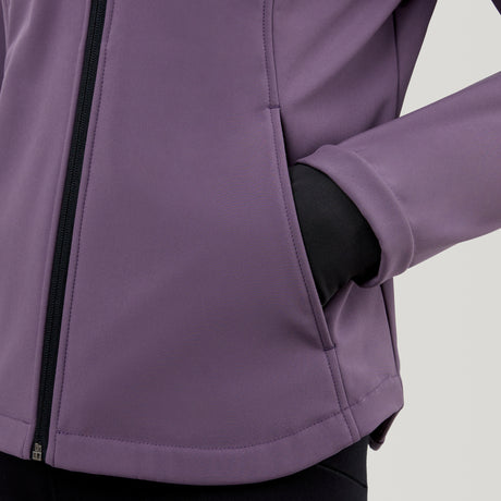 A person models the Clearance Women's FreeCycle® Super Softshell® Jacket in purple, with their right hand tucked into the side pocket; only their torso and part of one arm show against a plain background.