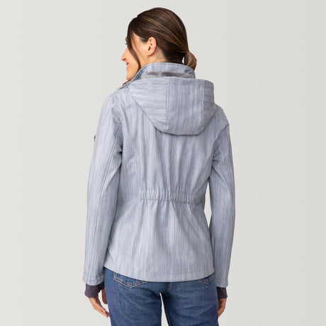 Back view of a woman wearing a light blue, water-resistant Women’s Aeris II Super Softshell® Jacket featuring a subtle herringbone pattern and a cinched waist.