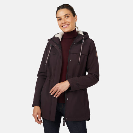 [Jessica is 5'9.5" wearing size S.] Women’s dark-brown hooded softshell jacket with zip-front closure, flap chest pockets, and adjustable drawstrings—features a sleeve patch and is paired with dark pants for a rugged, outdoor-ready look.