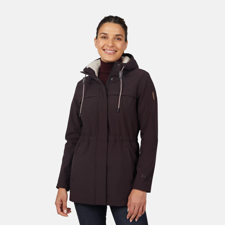 [Jessica is 5'9.5" wearing size S.] Women’s dark-brown hooded softshell jacket with zip-front closure, flap chest pockets, and adjustable drawstrings—features a sleeve patch and is paired with dark pants for a rugged, outdoor-ready look.