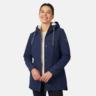 [Jessica is 5'9.5" wearing size S.] Free Country navy blue women’s softshell jacket with a fitted silhouette, zip-front closure, long sleeves, and adjustable hood drawstrings—styled with black pants for a sleek, minimalist outdoor look.