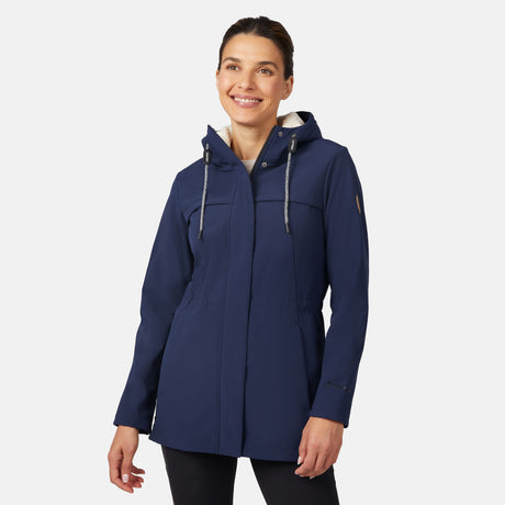 [Jessica is 5'9.5" wearing size S.] Free Country navy blue women’s softshell jacket with a fitted silhouette, zip-front closure, long sleeves, and adjustable hood drawstrings—styled with black pants for a sleek, minimalist outdoor look.