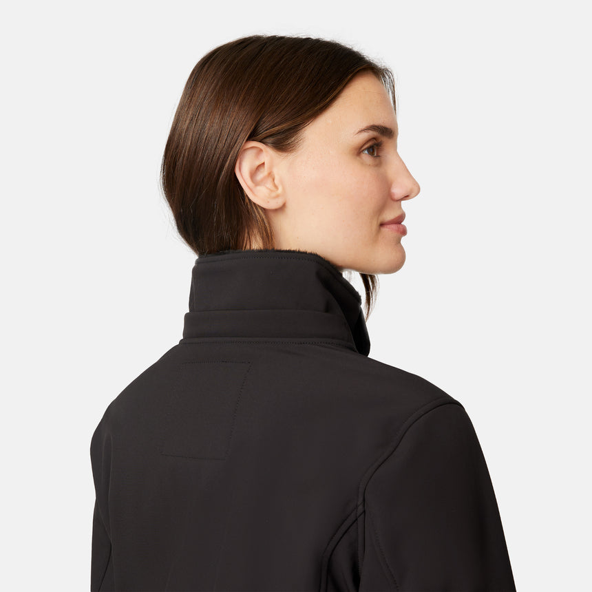 [Jessica is 5'9.5" wearing size S.] Woman wearing Free Country Women's Aeris II Super Softshell® Jacket in black with a full front zipper opening, soft lining, detachable hood, and water resistant and wind resistant stretch performance fabric, light grey background. Perfect women’s  jacket for fall weather.