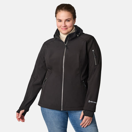 [Karissa is 5'9.5" wearing size 1X.] Woman wearing Free Country black hooded softshell jacket with sleeve zip pocket; worn over blue jeans, shown with raised arms to display fit and structure.
