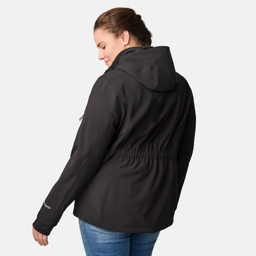 [Karissa is 5'9.5" wearing size 1X.] Woman wearing Free Country black hooded softshell jacket with sleeve zip pocket; worn over blue jeans, shown with raised arms to display fit and structure.