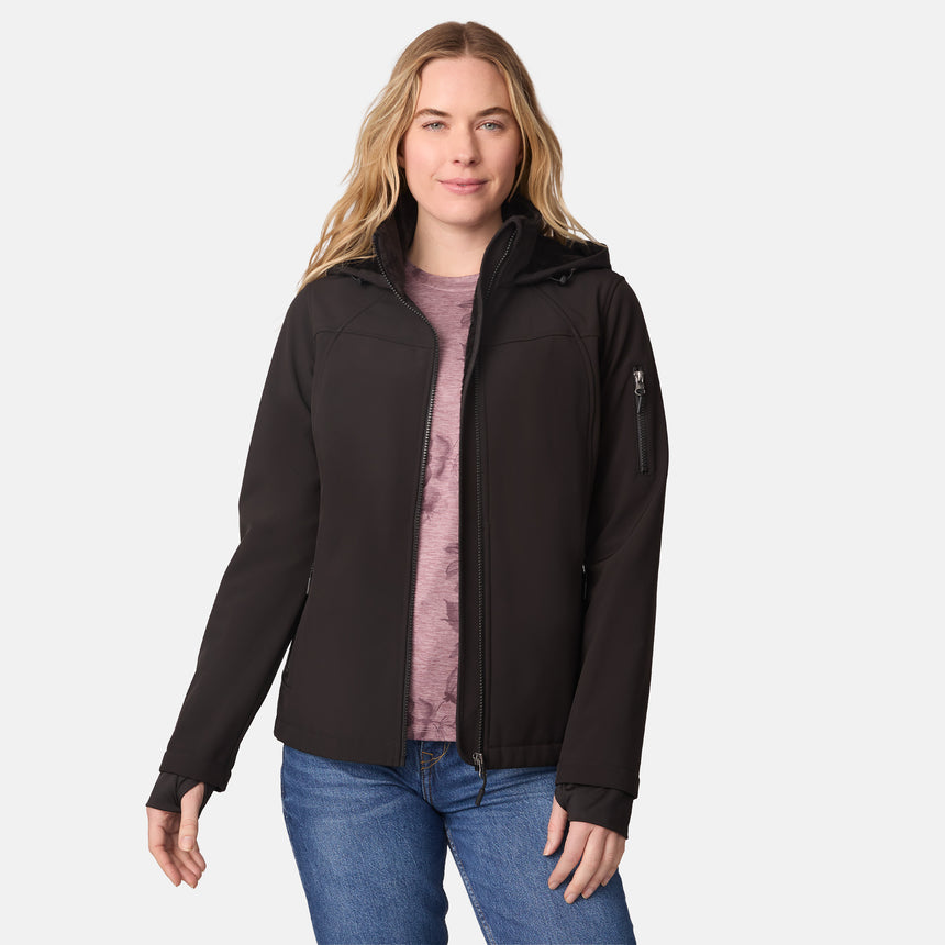 [CJ is 5'10" wearing size S.] Women’s black softshell zip-up jacket with high collar, thumb holes, and sleeve pocket — sleek, performance-ready outerwear for active wear