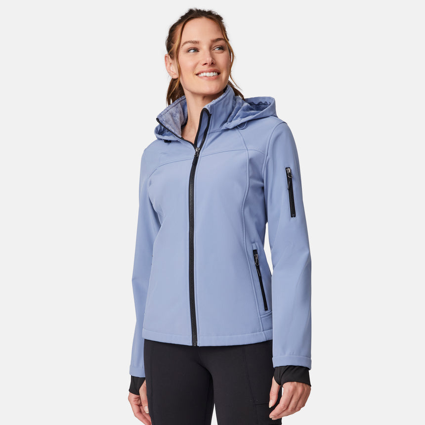 [Emily is 5'9" wearing size S.] Women’s light blue softshell hooded jacket with black zippers, sleeve pocket, and front zip closure — lightweight, weather-resistant layer for active wear