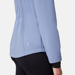 [Emily is 5'9" wearing size S.] Women’s light blue softshell hooded jacket with black zippers, sleeve pocket, and front zip closure — lightweight, weather-resistant layer for active wear