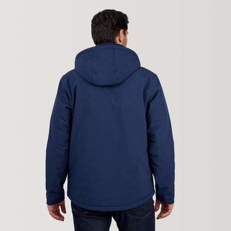 A man wears the Clearance Men's Thermo Softshell® Mid Weight Jacket in navy blue with dark jeans, standing facing away from the camera against a plain, light-colored background.