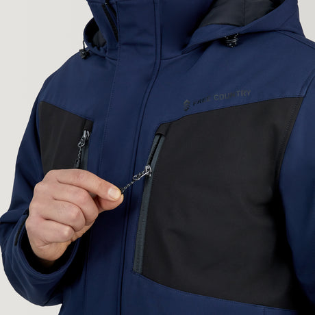 A person wearing a blue and black Men's Thermo Softshell® Mid Weight Jacket unzips the chest pocket with their right hand. The brand name Clearance is visible on the upper chest.