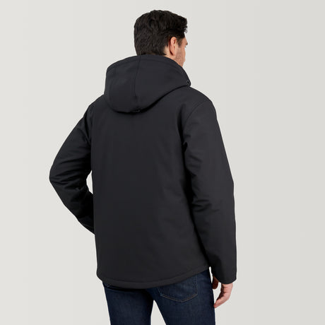 A man faces away, wearing the Clearance Men's Thermo Softshell® Mid Weight Jacket in black and dark blue jeans, standing against a plain light gray background.