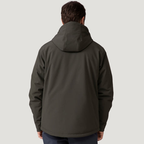 A person wearing the Clearance Men's Thermo Softshell® Mid Weight Jacket in dark green, which is water resistant, stands facing away from the camera against a plain light gray background.