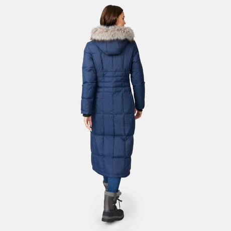 [Jessica is 5'9.5" wearing size S.] Woman wearing Free Country Women's Full Length Splendor Down Jacket in navy blue with a full front zipper opening, lower pockets, calf length, a detachable hood with faux fur trim, and water resistant and wind resistant stretch performance fabric, light grey background. Best women’s jacket for winter weather.