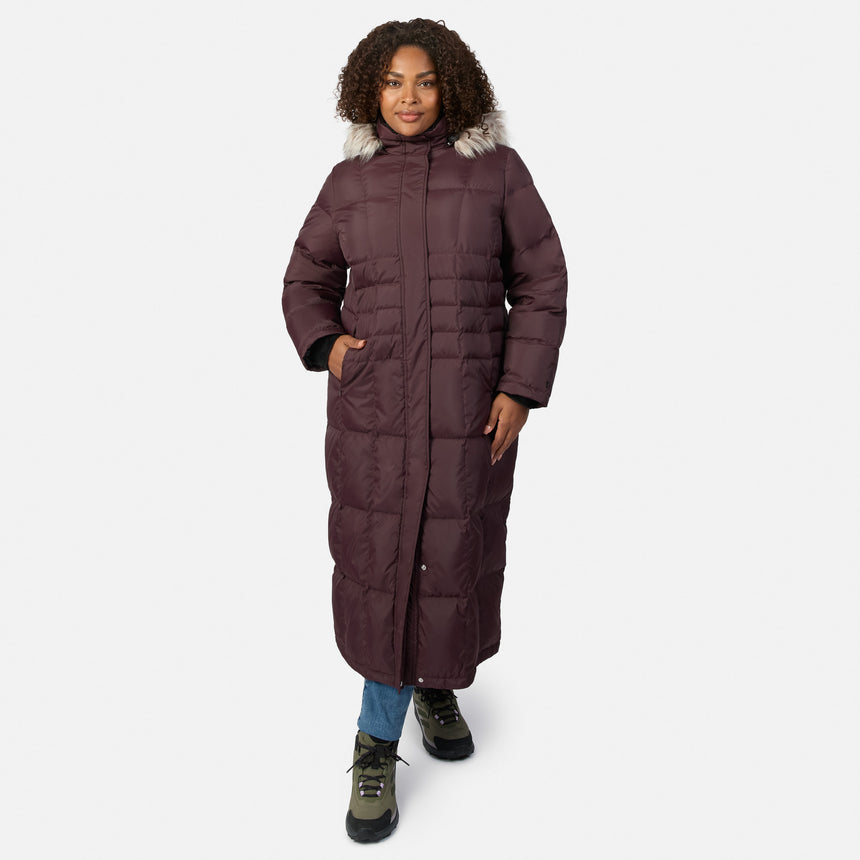 Plus size model wearing burgundy full length Splendor down jacket with a fur trimmed hood