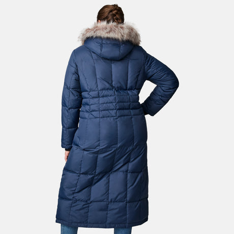 A person is seen from behind wearing the Women's Plus Size Full Length Splendor Down Jacket by Free Country, a long blue parka with a fur-lined hood, standing against a plain light background.