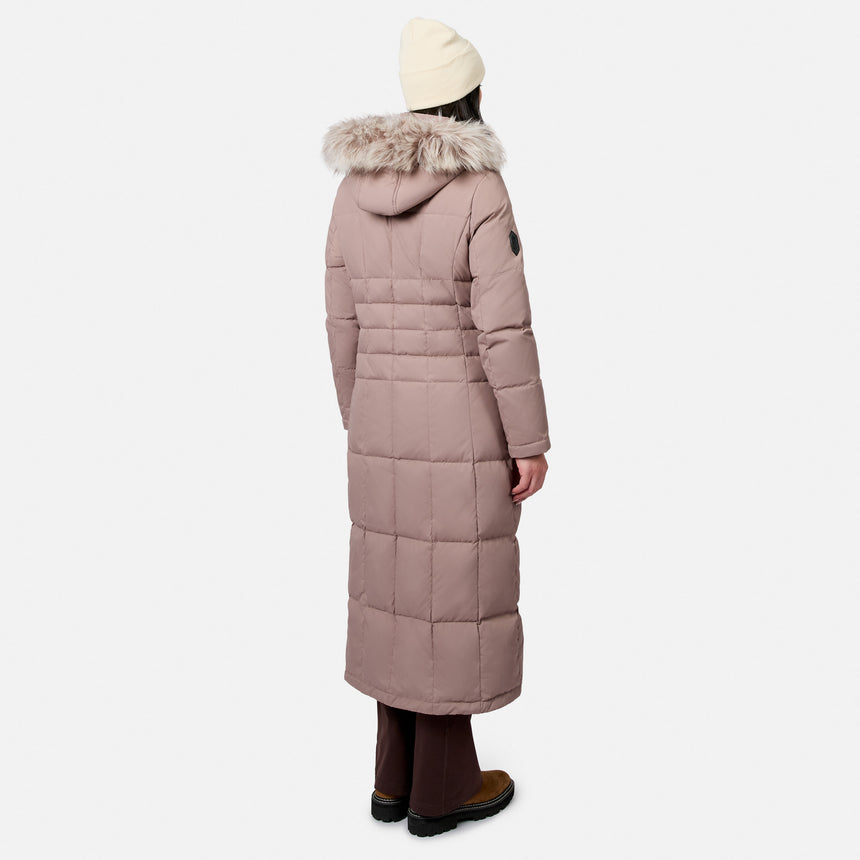 Back view of a model wearing a dusty pink full length Splendor Down Jacket with a fur lined hood.