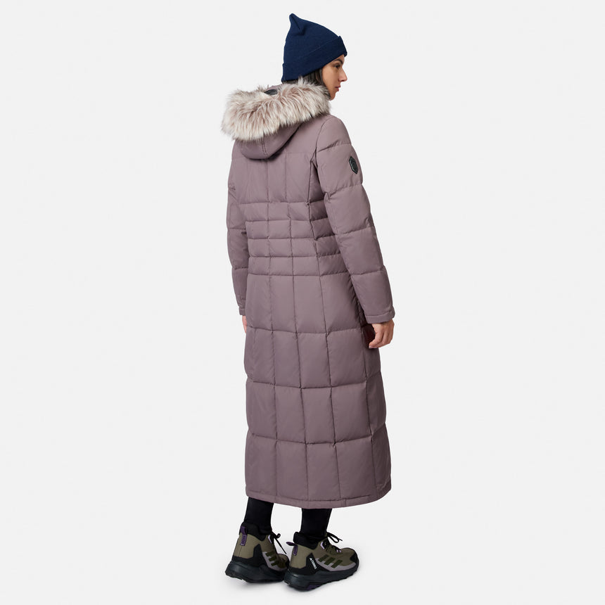 Back view of a mauve full length Splendor Down Jacket with fur trimmed hood and blue knit beanie
