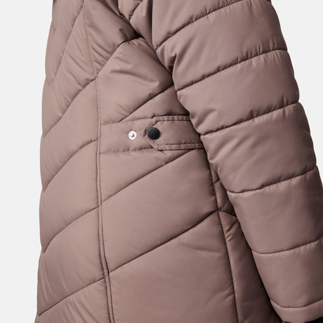Close-up of the side of the Women's Plus Size Unstoppable II Poly Air Touch Jacket by Free Country in mauve, featuring diagonal quilting and a small flap pocket with a black snap button.