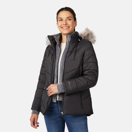 [Olga is 5'9" wearing size S.] Model wearing black quilted jacket with faux fur hood and attached bib — layered warmth and stylish silhouette for winter outings