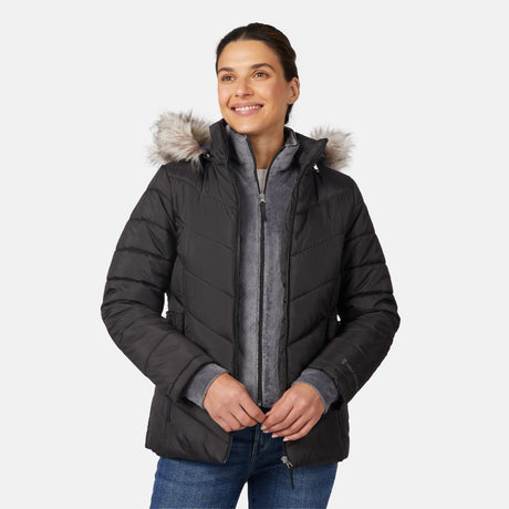 [Olga is 5'9" wearing size S.] Model wearing black quilted jacket with faux fur hood and attached bib — layered warmth and stylish silhouette for winter outings