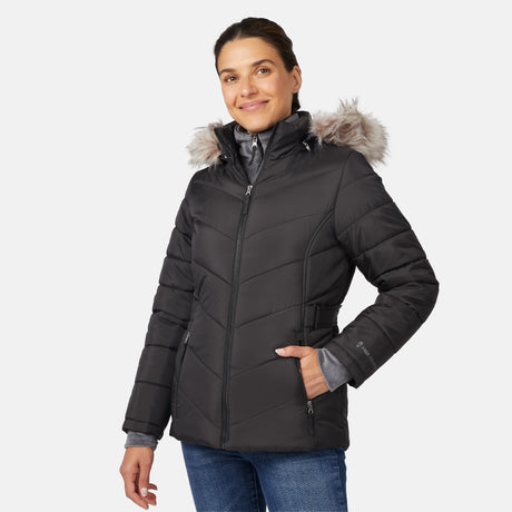 [Olga is 5'9" wearing size S.] Model wearing black quilted jacket with faux fur hood and attached bib — layered warmth and stylish silhouette for winter outings