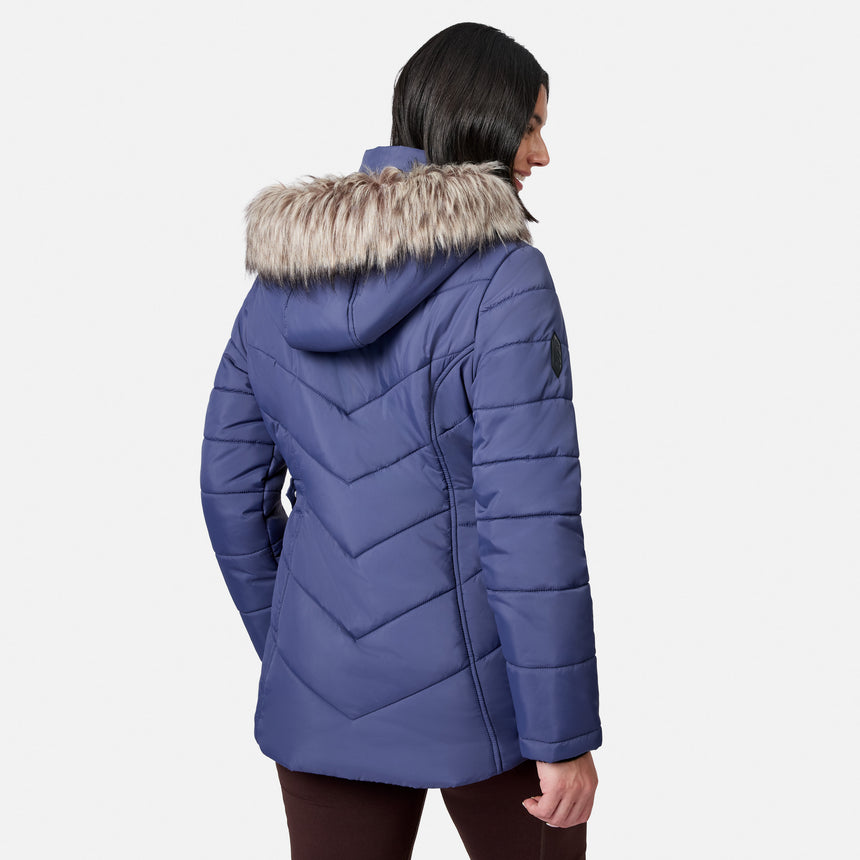 [Model is wearing size S.] A woman shown from the back wearing a blue quilted puffer jacket with a faux-fur trimmed hood, photographed against a light gray studio background.
