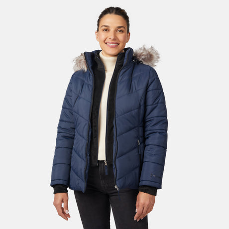 [Olga is 5'9" wearing size S.] Model wearing blue quilted jacket with faux fur hood and attached bib — layered warmth and stylish silhouette for winter outings