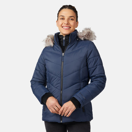 [Olga is 5'9" wearing size S.] Model wearing blue quilted jacket with faux fur hood and attached bib — layered warmth and stylish silhouette for winter outings