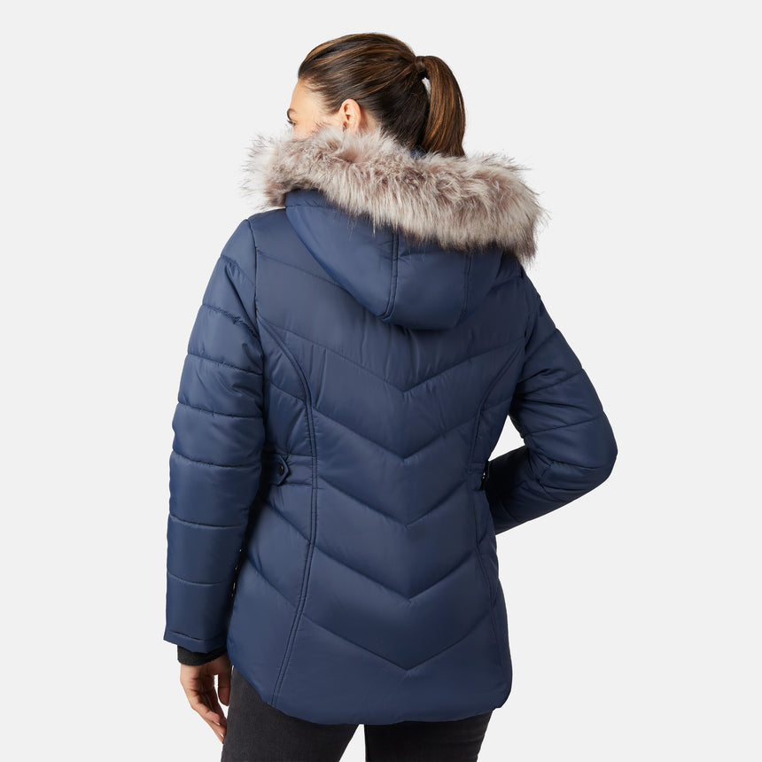[Olga is 5'9" wearing size S.] Model wearing blue quilted jacket with faux fur hood and attached bib — layered warmth and stylish silhouette for winter outings