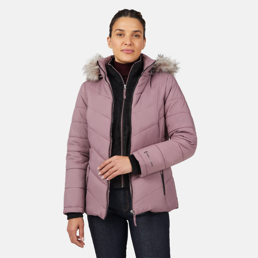 [Olga is 5'9" wearing size S.] Model wearing pink quilted jacket with faux fur hood and attached bib — layered warmth and stylish silhouette for winter outings