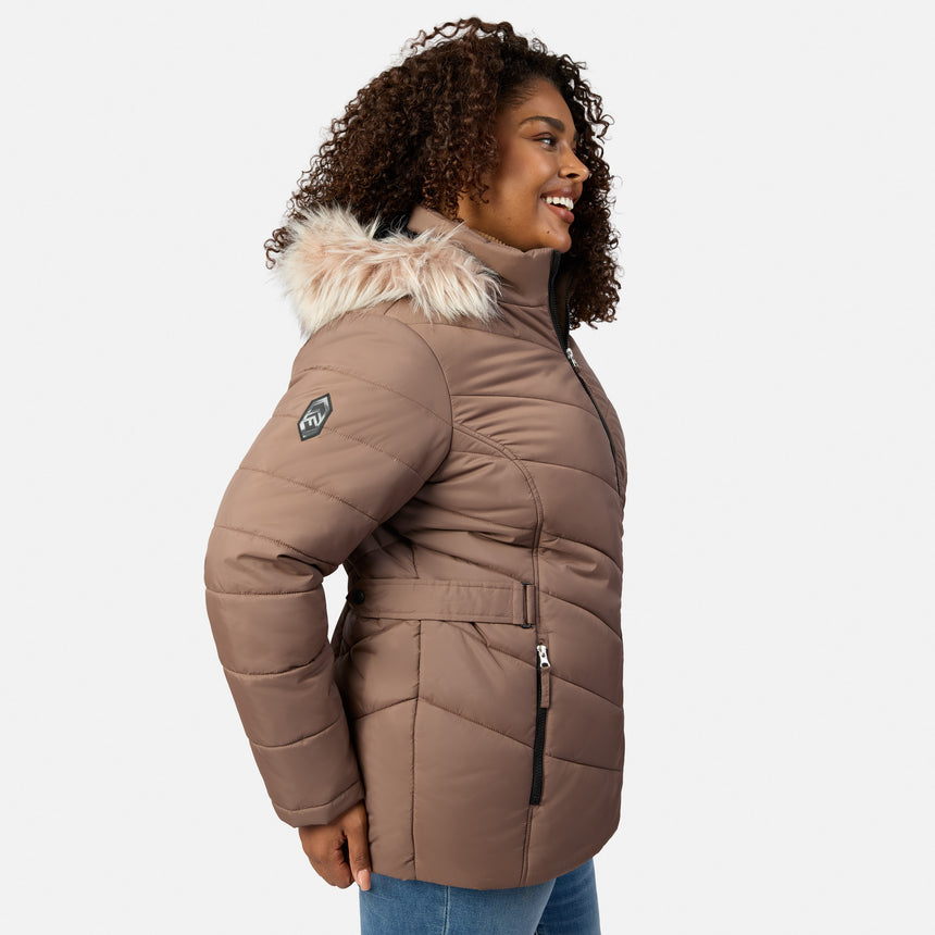 [Model is wearing size 1X] A woman wearing a taupe brown puffer jacket with a fluffy cream faux-fur trimmed hood, shown from a side profile against a light gray background.