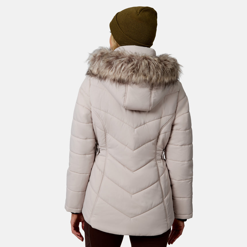 [Model is wearing size S.] A woman viewed from the back wearing a light beige quilted puffer jacket with a faux-fur trimmed hood and an olive green beanie, against a light gray studio background.